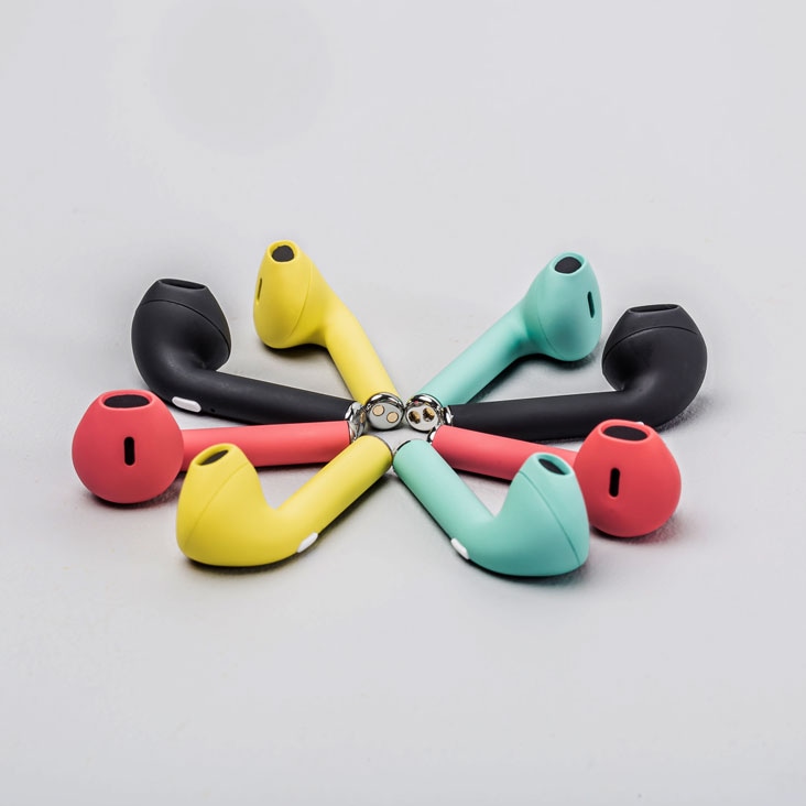 Colorful earbuds arranged in a circle, shown before background removal services by PathEdits. Unedited.