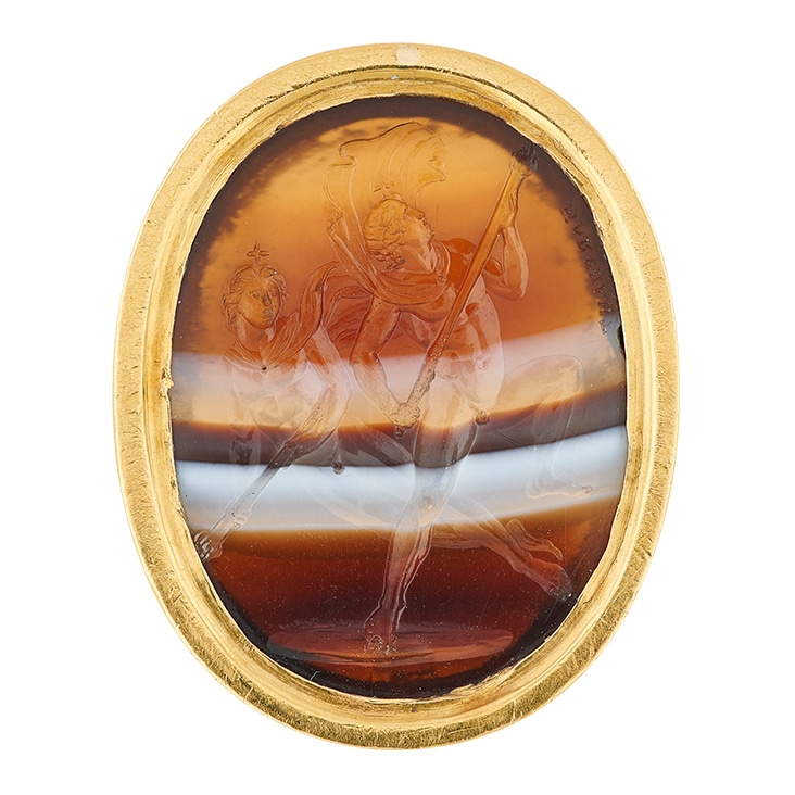 Detailed cameo brooch with gold trim, edited using clipping path for a clear and clean presentation.