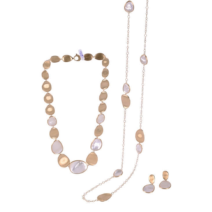 Gold and pearl jewelry set featuring a necklace, chain, and earrings, displayed after background removal.