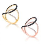 Two swirled rings in gold and rose gold, featuring black and white diamond accents, arranged side by side.