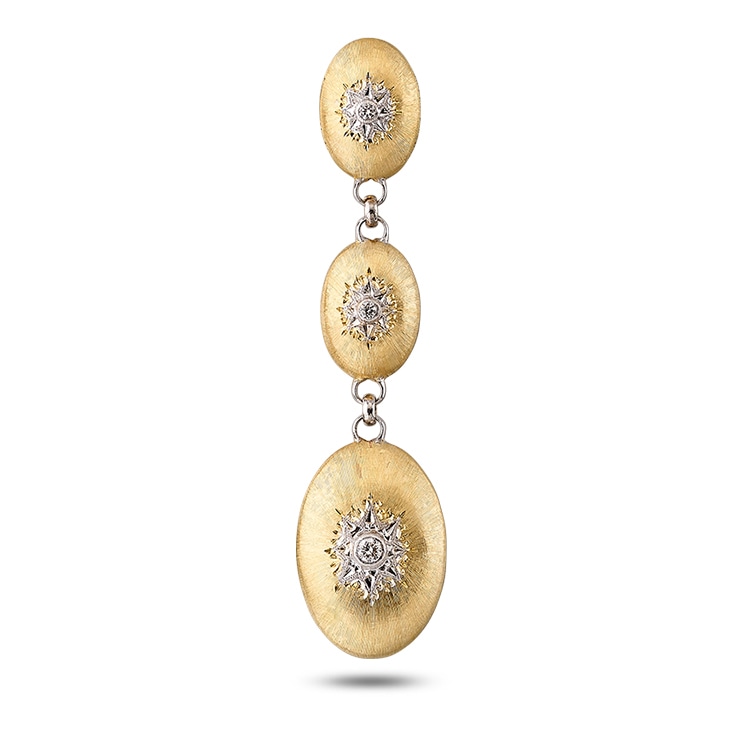 A gold and diamond pendant with a floating shadow effect, creating the illusion of it hovering above a surface.