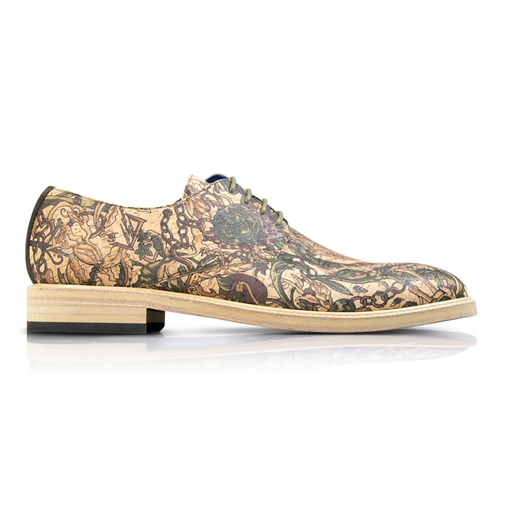 A printed leather dress shoe with a reflection shadow, creating the appearance of it resting on a polished surface.