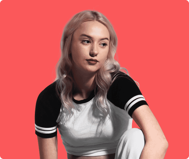 Young blonde woman portrait edited onto a bold red background using image masking.