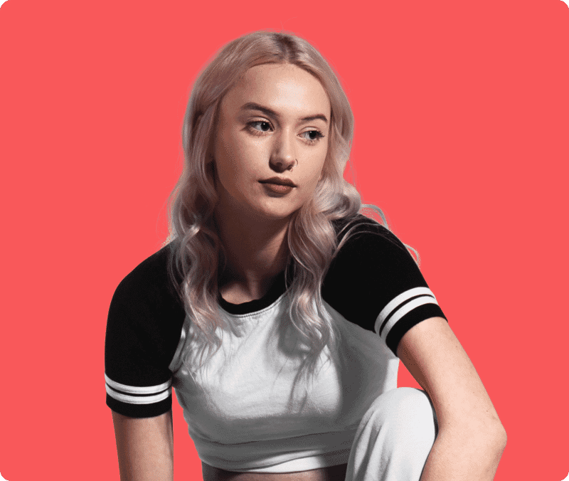 Young blonde woman portrait edited onto a bold red background using image masking for clean hair detail.