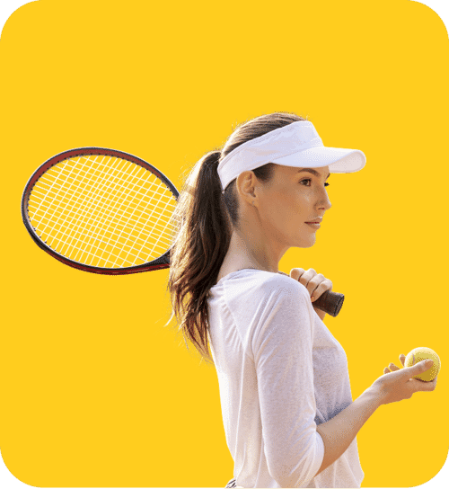 Female tennis player holding a racket and tennis ball on a bright yellow background with clean cutout photo editing.