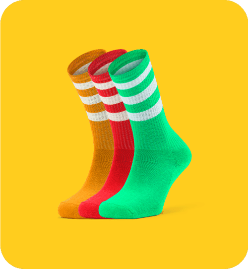 Three colorful striped socks on a bright yellow background with clean ecommerce product photo editing.