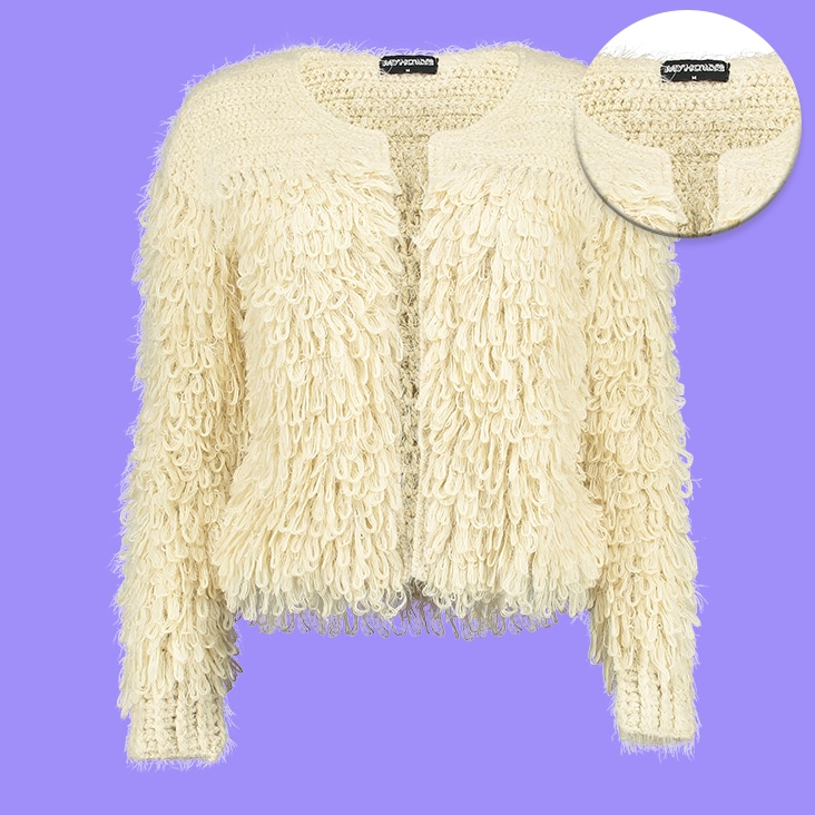 Medium complexity image masking applied to a cream-colored textured sweater, ensuring detailed edge refinement and background removal.