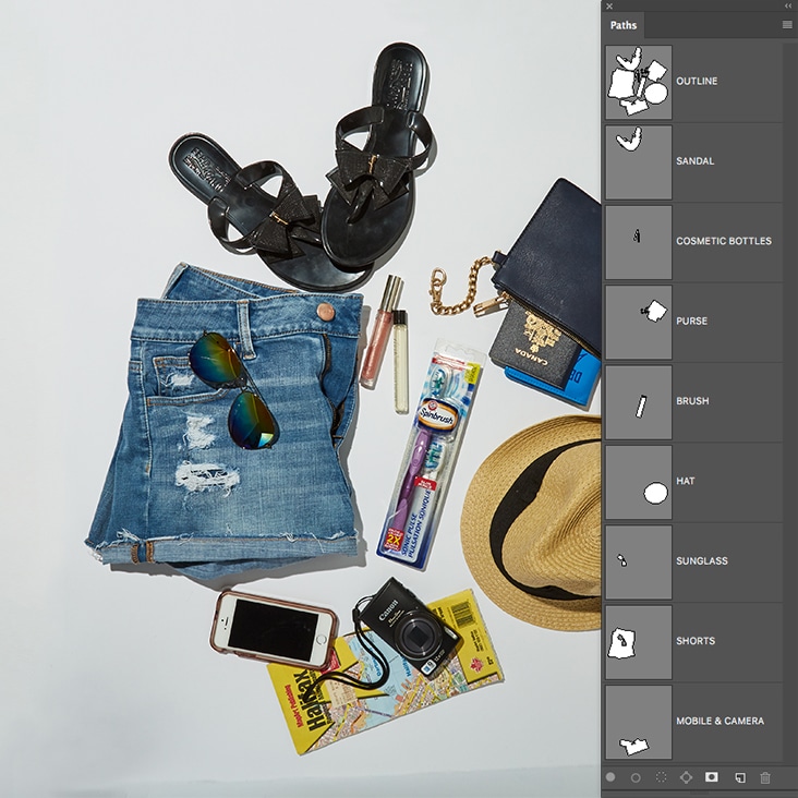 Intricate multi-clipping path services for travel essentials, including accessories and clothing.