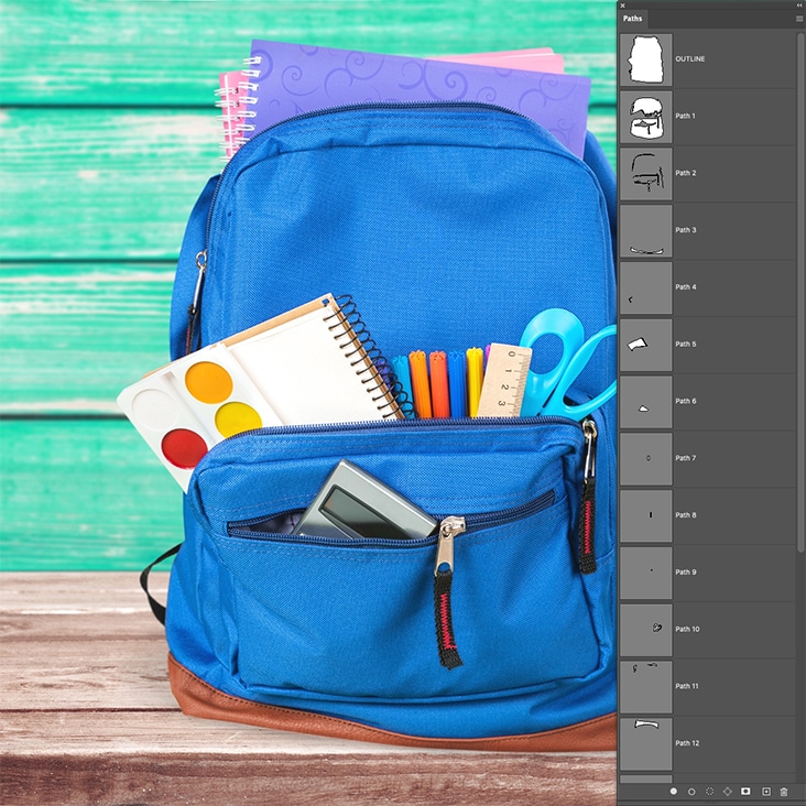 Detailed multi-clipping path services for backpacks with multiple elements like accessories and tools.