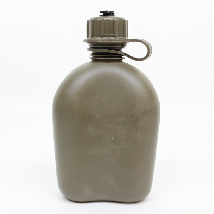 Olive green canteen with visible dust and spots on the surface, shown before dust, spot, and scratch removal edits.