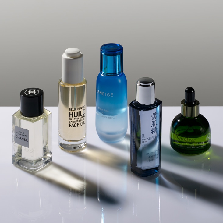 Arrangement of luxury skincare bottles with reflections removed for a clean, professional presentation.