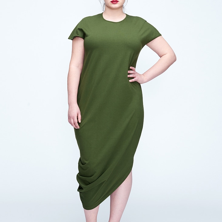 Green dress with wrinkles removed, highlighting a smooth and refined fabric finish for a polished look.
