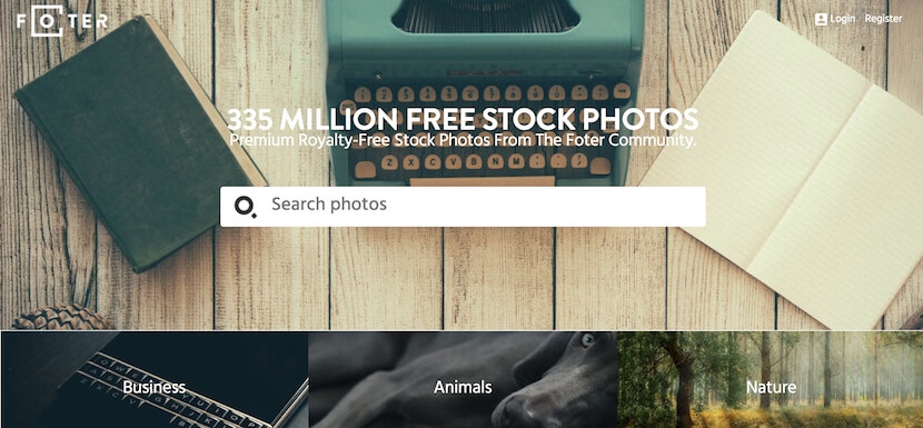 Foter homepage with search bar and typewriter background, offering 335 million royalty-free stock photos