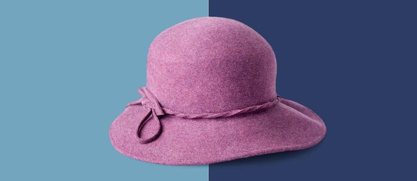 Purple felt hat on split blue and navy background, highlighting color change editing techniques.