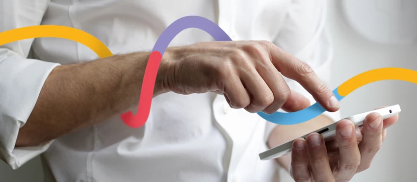 Close-up of a hand using a smartphone, suggesting mobile photo editing capabilities