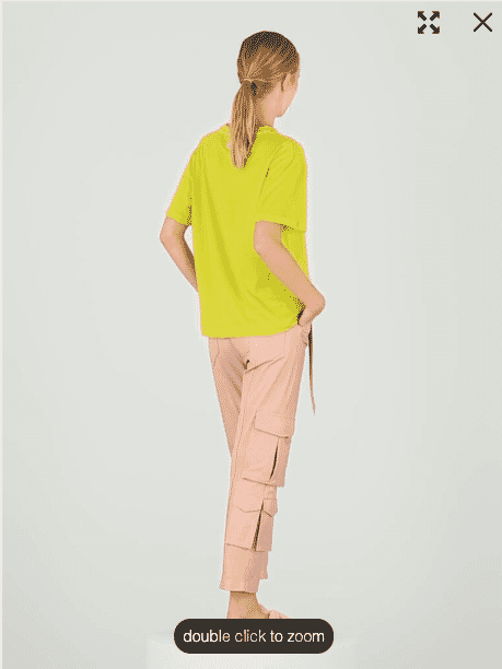 Back view of model wearing Jazmin Chebar green Vitro T-shirt and pink cargo pants