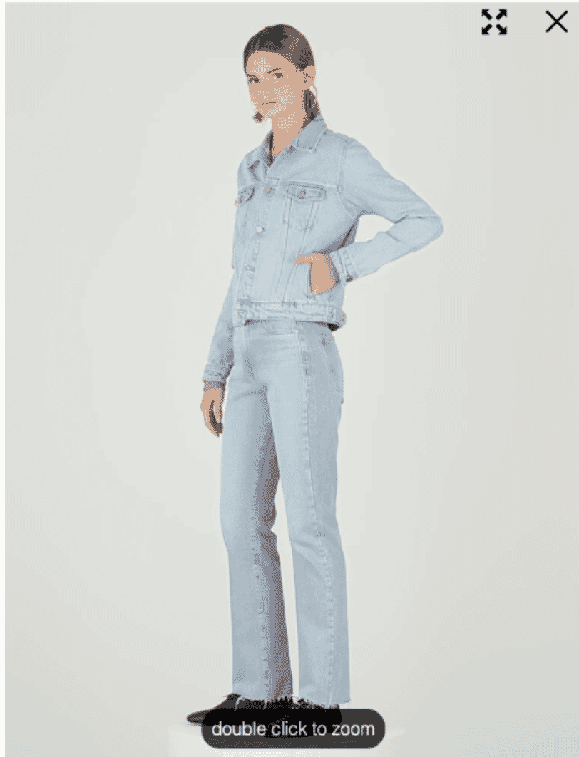 Model in light denim jacket and jeans set with hands in pockets, side view