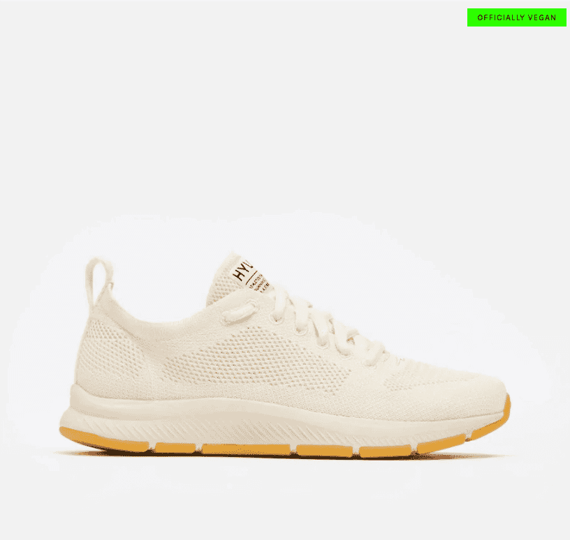 Side view of Hylo vegan sneaker in cream color with gum sole, labeled