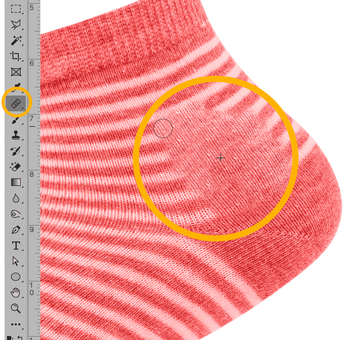 Healing Brush tool applied on red striped sock fabric in Photoshop, with tool highlighted on the toolbar.