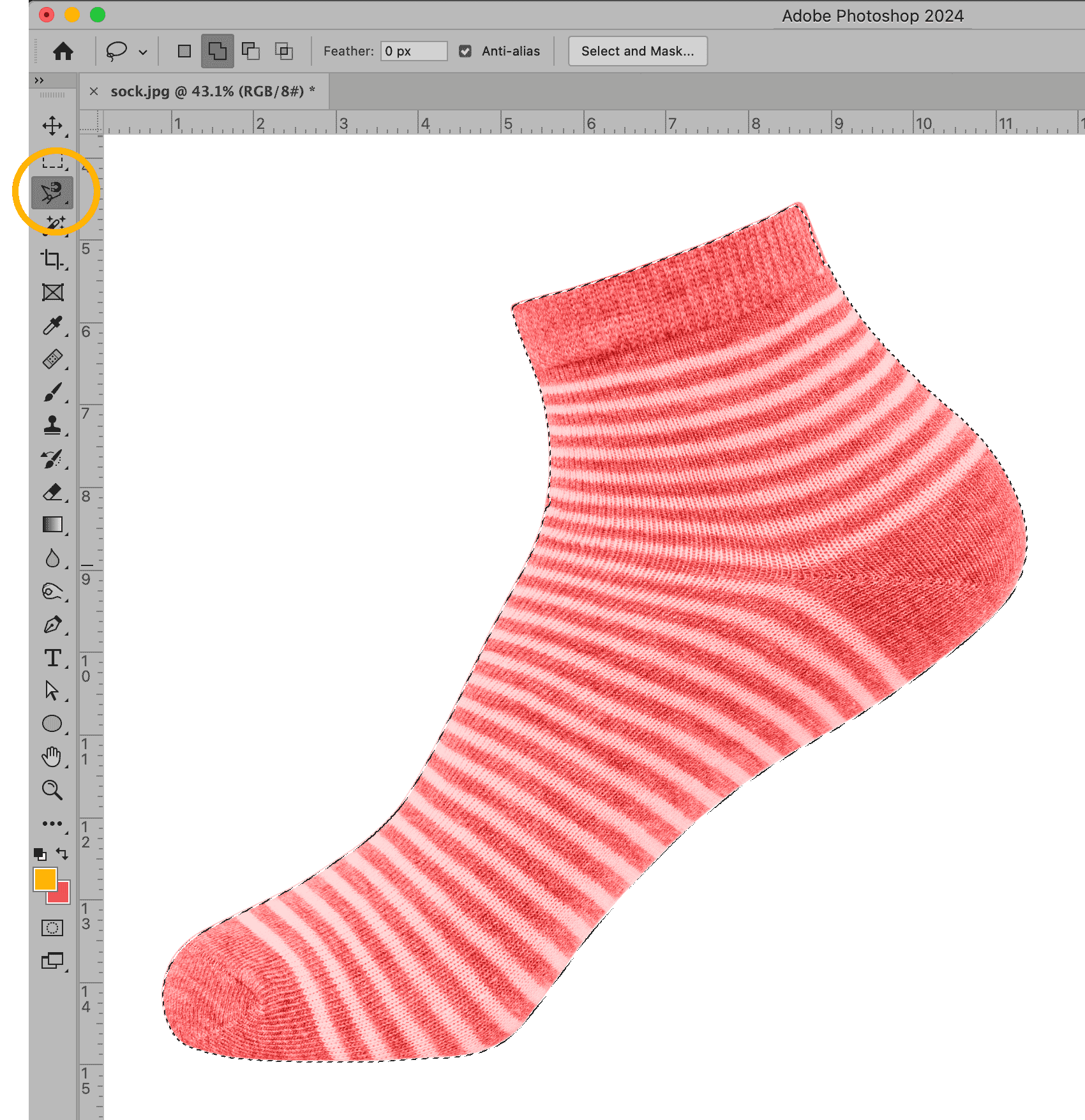 Photoshop interface using the Magnetic Lasso Tool to select a red and white striped sock.