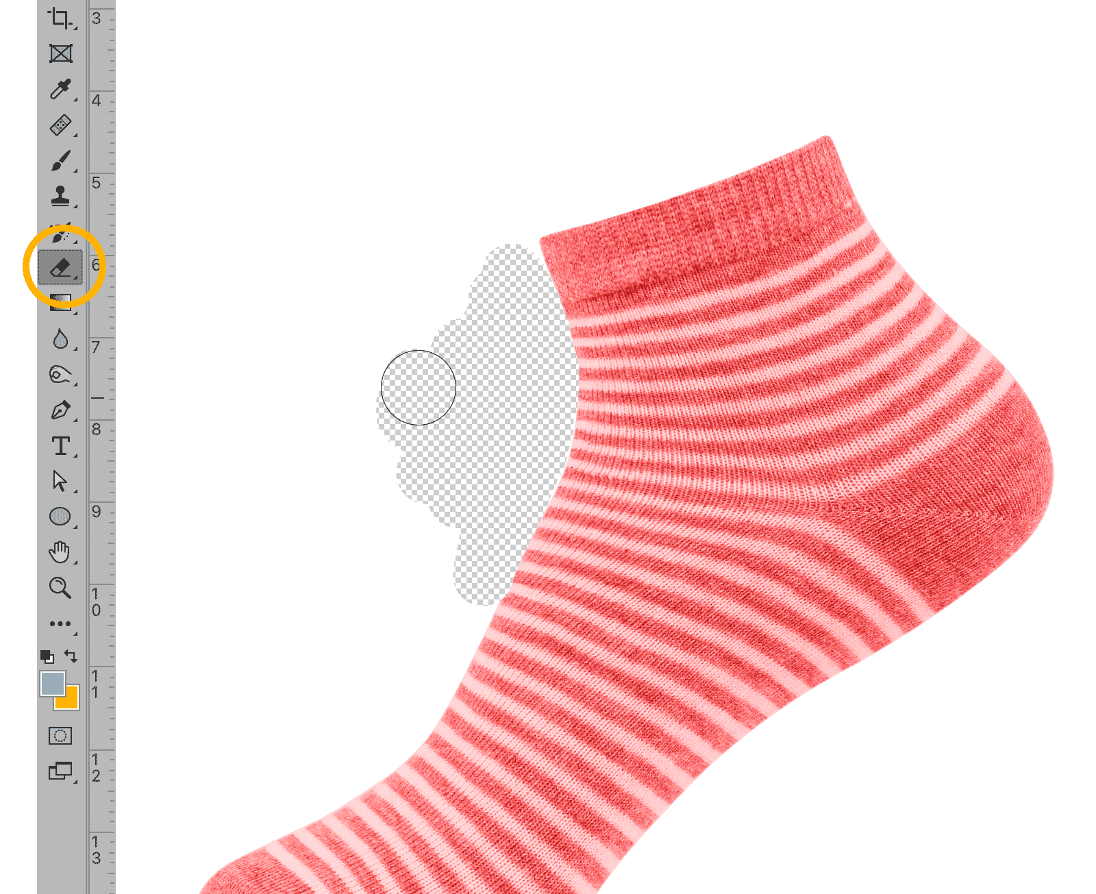 Eraser tool used on a red and white striped sock in Photoshop, showing transparent background removal.