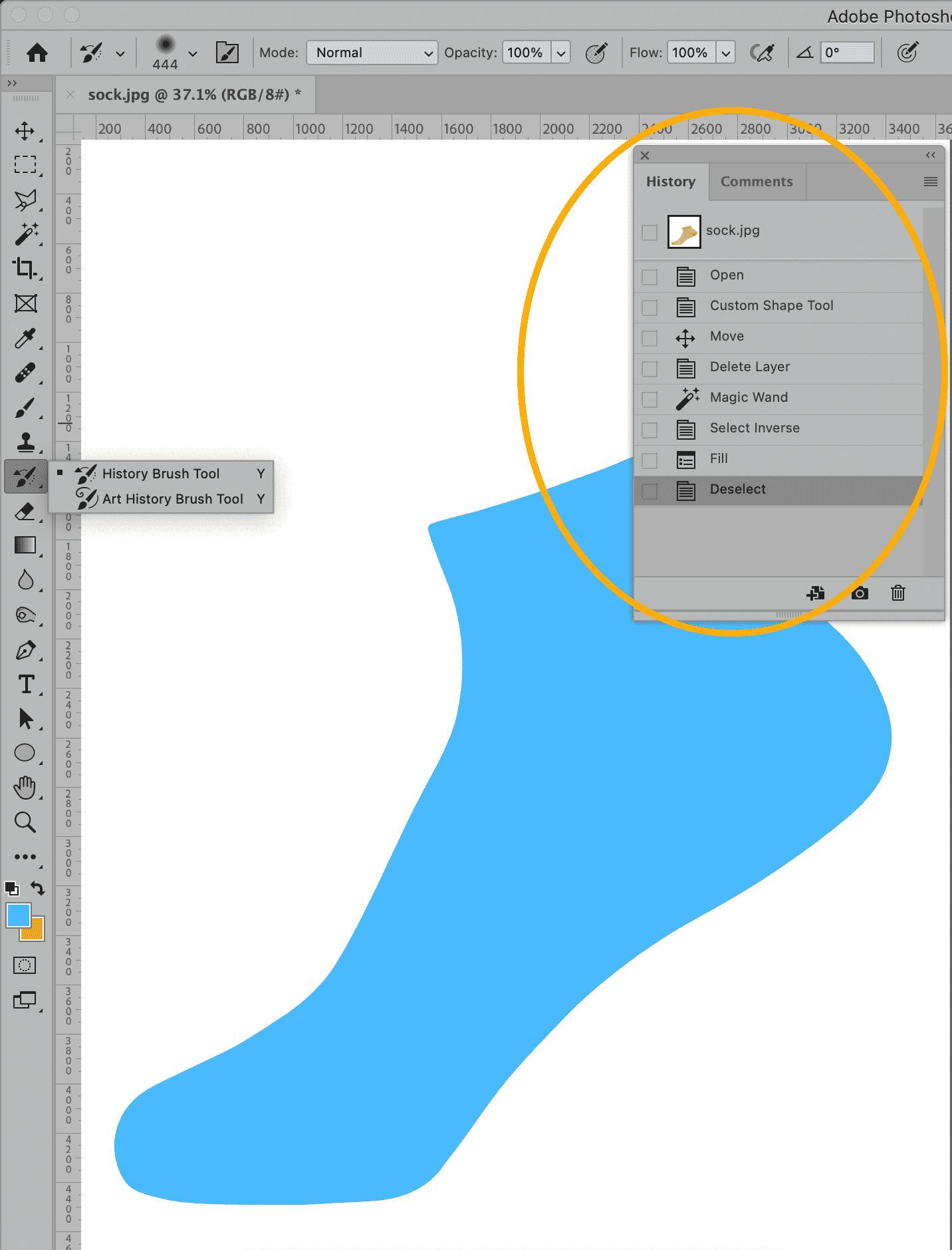 Adobe Photoshop interface showing the History panel and the History Brush Tool options with a blue shape on the canvas.