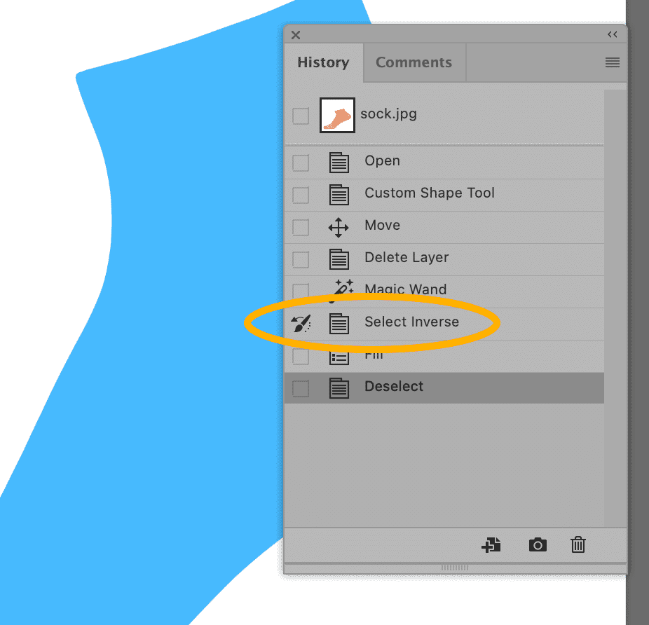 Close-up of the Photoshop History panel highlighting the "Select Inverse" action with a blue shape in the background.