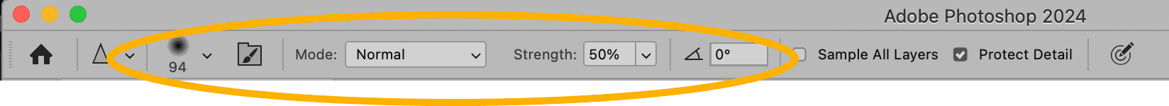 Adobe Photoshop options bar displaying settings for the Sharpen Tool, including mode, strength, angle, and sample all layers.