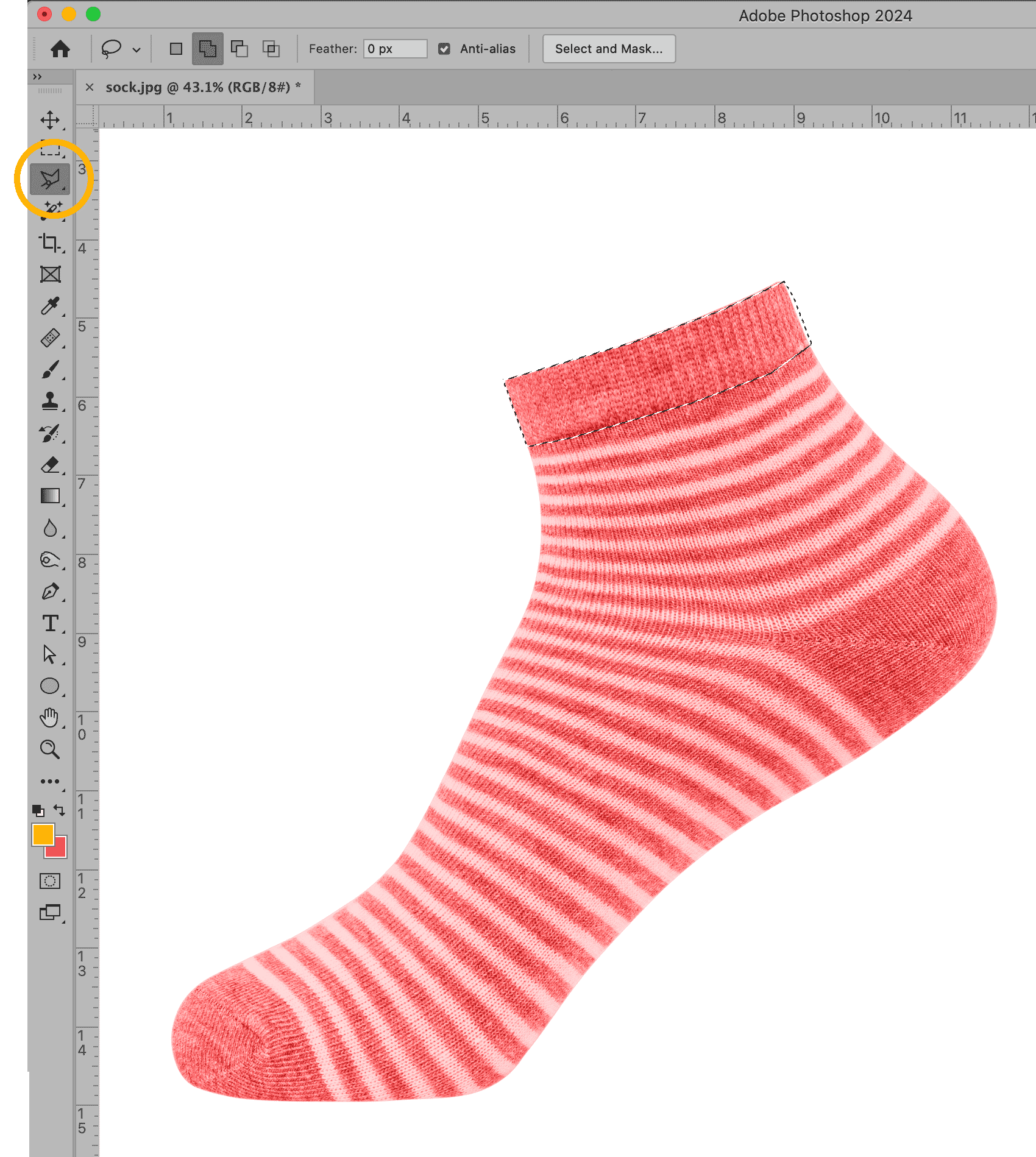 Photoshop interface using the Polygonal Lasso Tool to create a selection around a red and white striped sock.