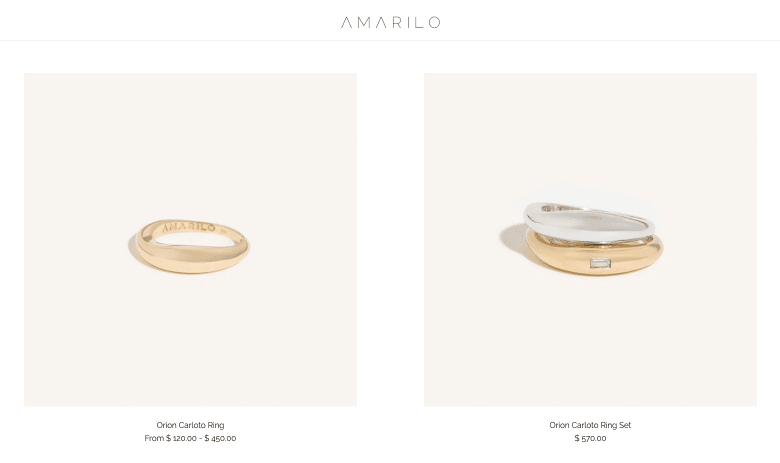 Gold and silver Orion Carloto rings by Amarilo displayed on a light background