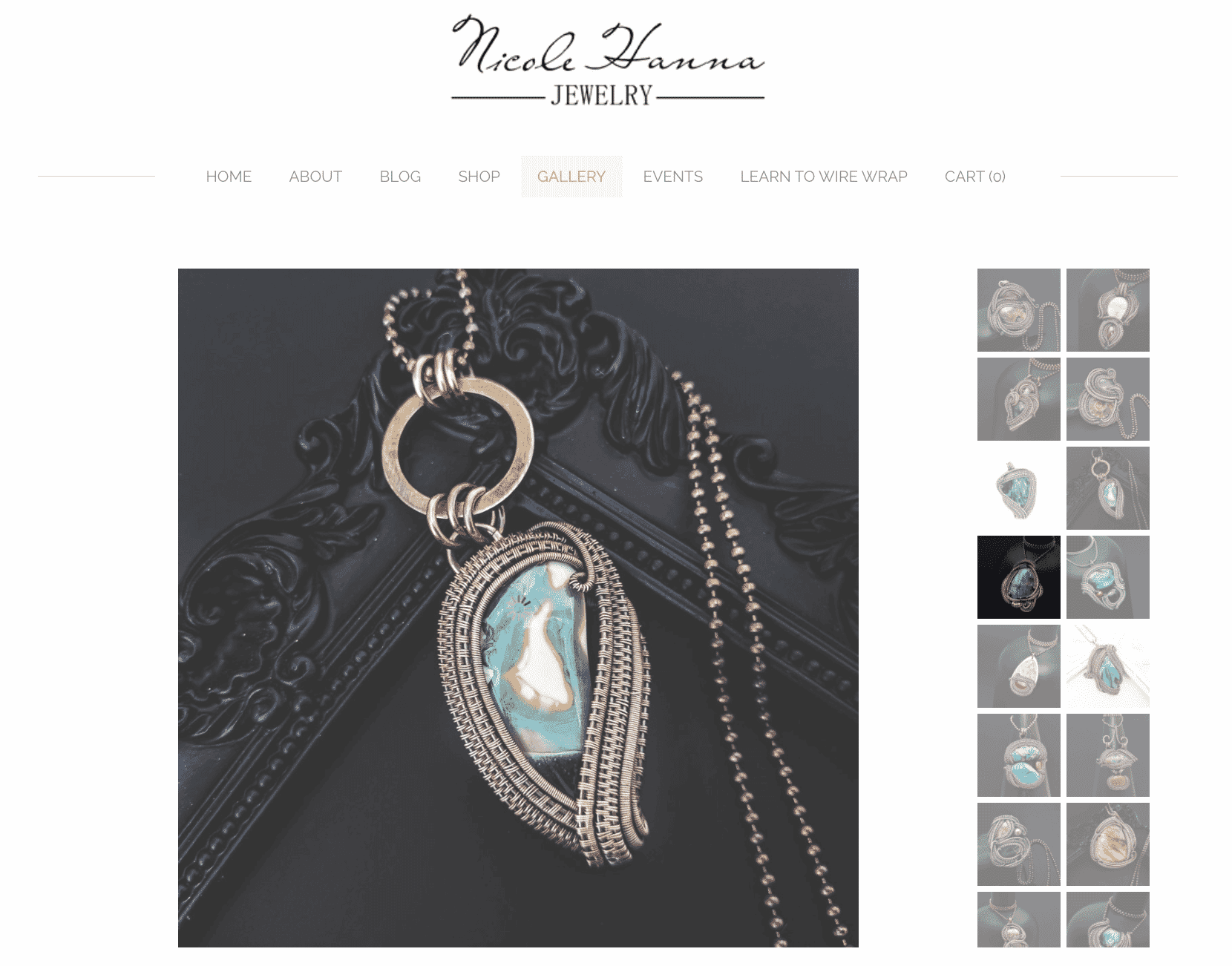 Intricate wire-wrapped pendant by Nicole Hanna with a colorful gemstone on a dark ornate background