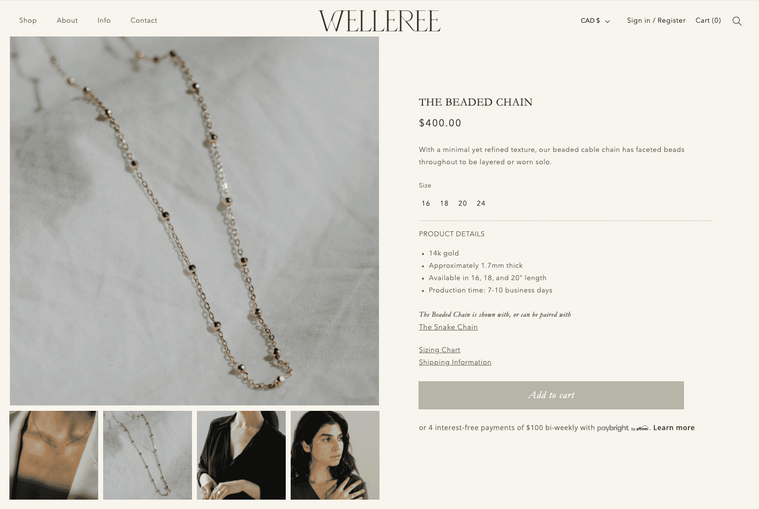 Delicate 14k gold beaded chain necklace by Welleree displayed on a textured fabric background