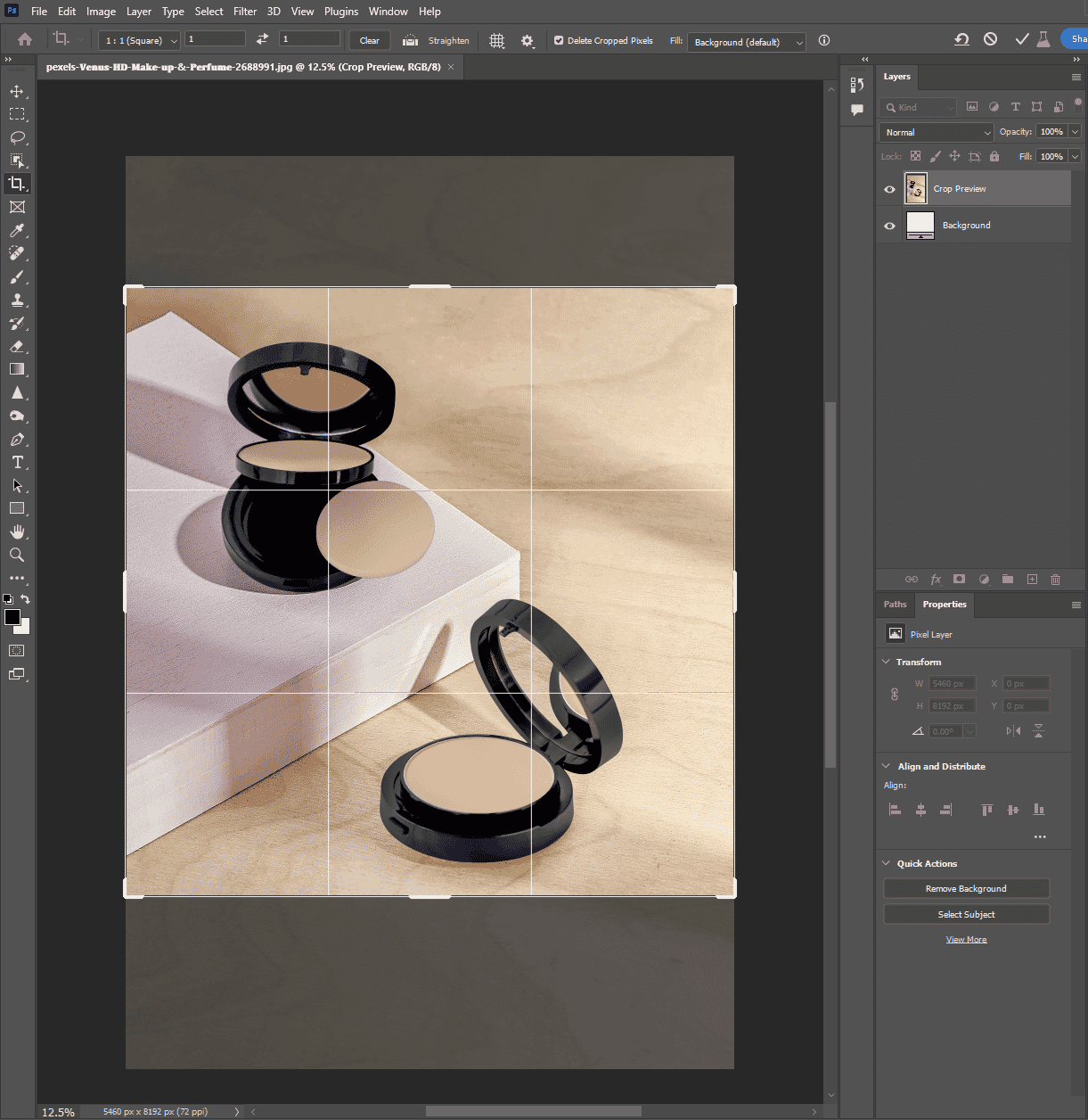 Photoshop window showing crop tool applied to an open compact powder image with grid lines for precise adjustment.