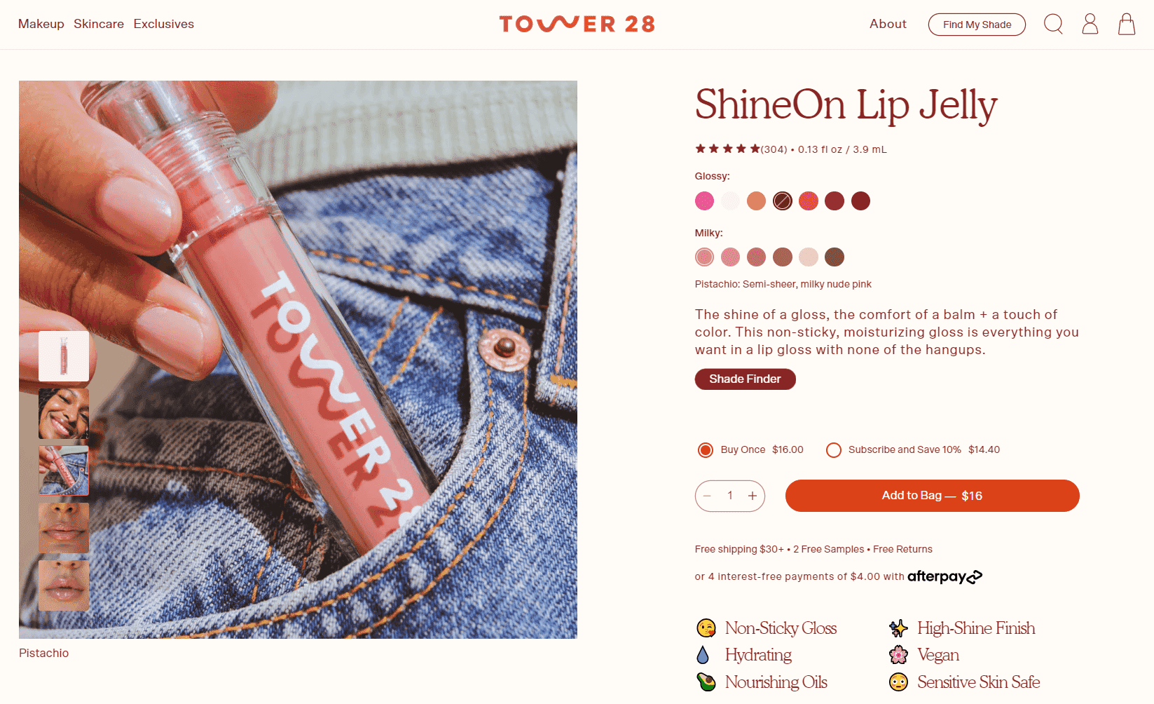 Close-up of Tower 28 ShineOn Lip Jelly in a pink shade, placed in a denim pocket, with product details and color options.