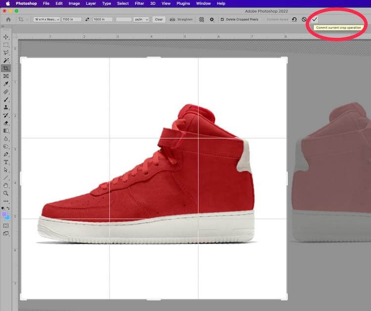 Photoshop crop tool active on a red sneaker image with "Commit current crop operation" checkmark highlighted
