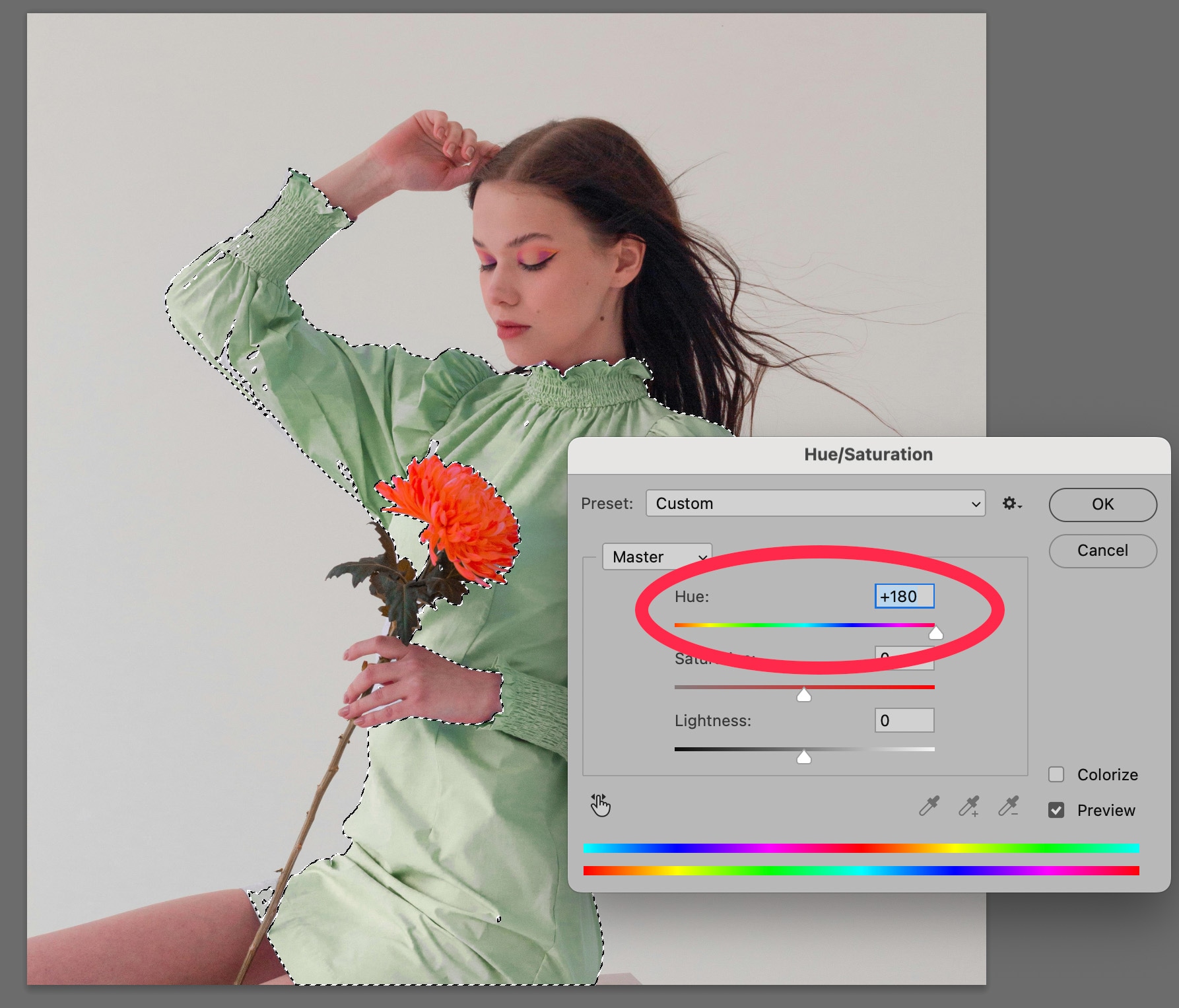 Woman in dress with selected hue/saturation adjustment in Photoshop, showing hue shifted to +180 for color change effect.