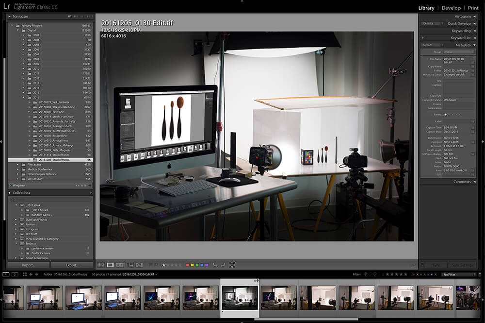 Photo studio setup for organizing product images in a date-based digital asset management system.