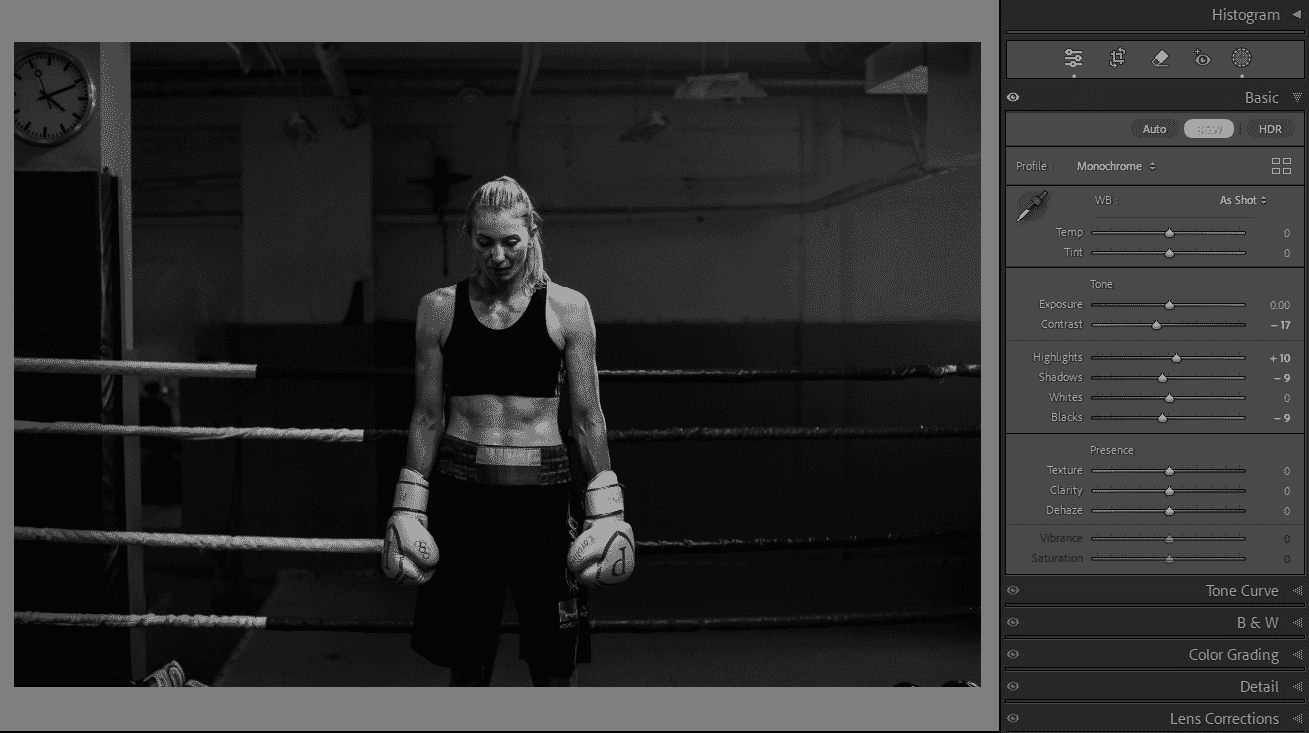 Black and white image of a female boxer in the ring, edited in Adobe Lightroom with monochrome settings and adjustments.
