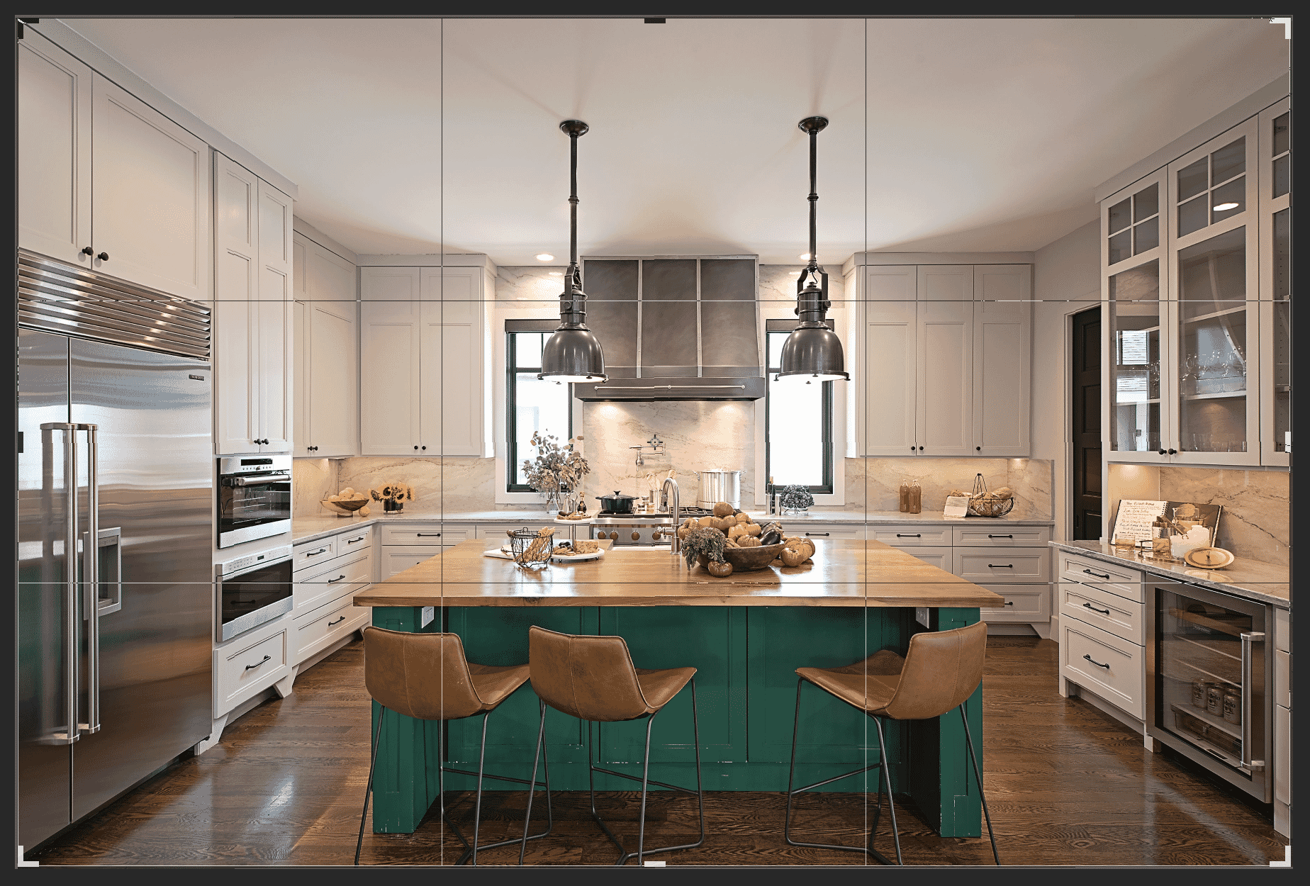 Modern kitchen with green island, brown stools, and cropping guides for photo editing