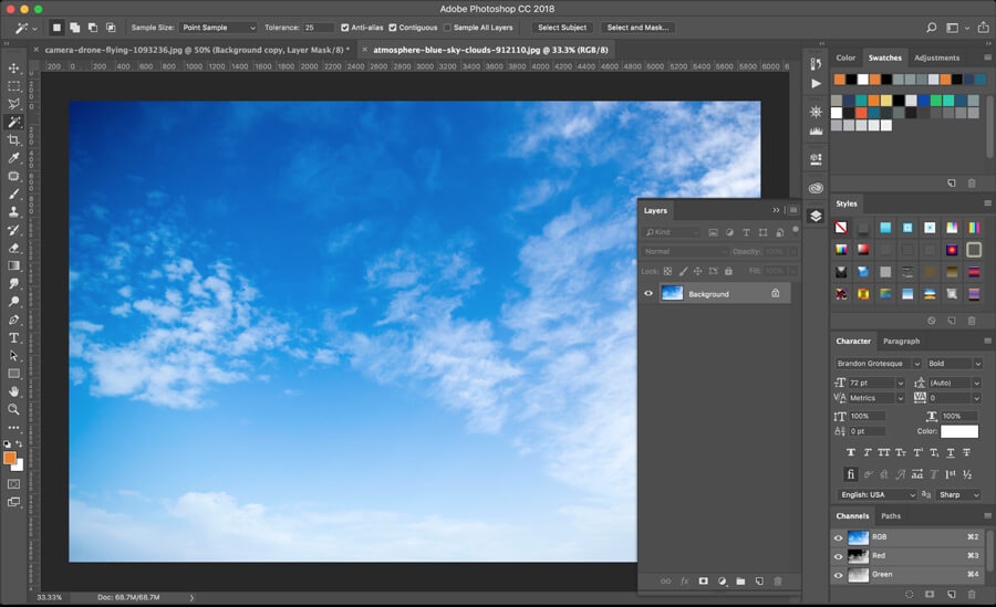 Photoshop CC18 workspace with new blue sky background layer for image enhancement.
