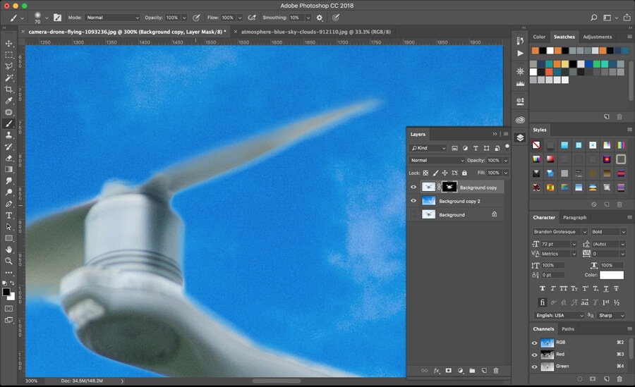 Close-up of layer mask adjustments on drone propeller for seamless sky blend in Photoshop CC18.