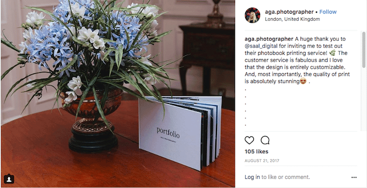 Photobook portfolio display on table with floral arrangement, shared by photographer in appreciation post