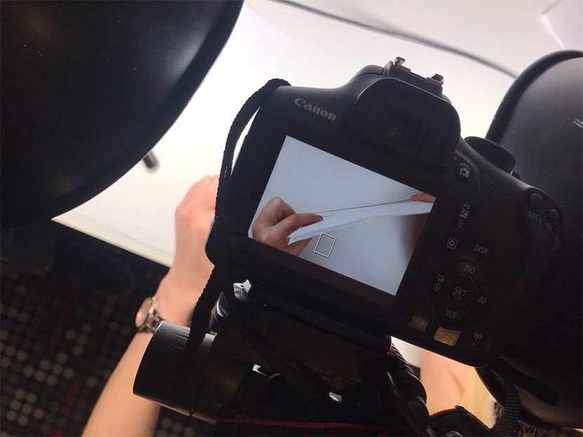 Close-up of Canon camera capturing jewelry with professional lighting