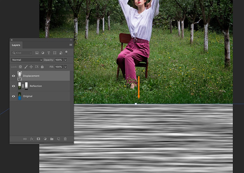 Adjusting the position of a displacement layer beneath the reflection layer in Photoshop for a seamless mirror effect.
