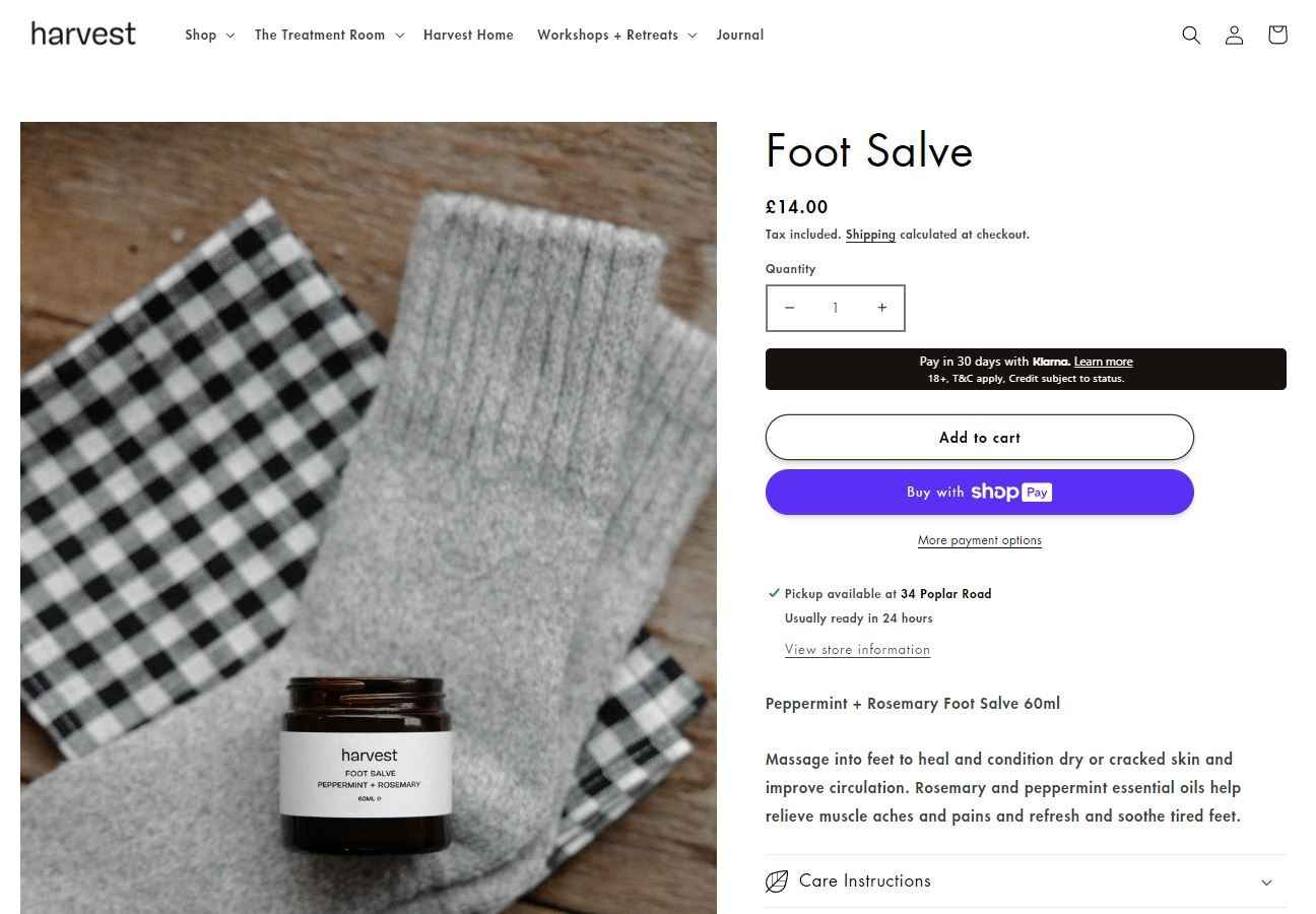 Harvest foot salve with peppermint and rosemary for dry skin, displayed on cozy socks