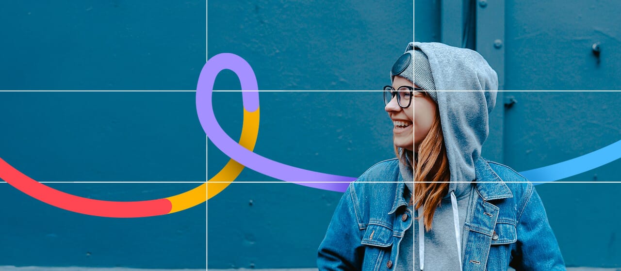 Young woman smiling in hoodie and denim jacket in front of a blue wall with colorful Path branding swirl overlay.