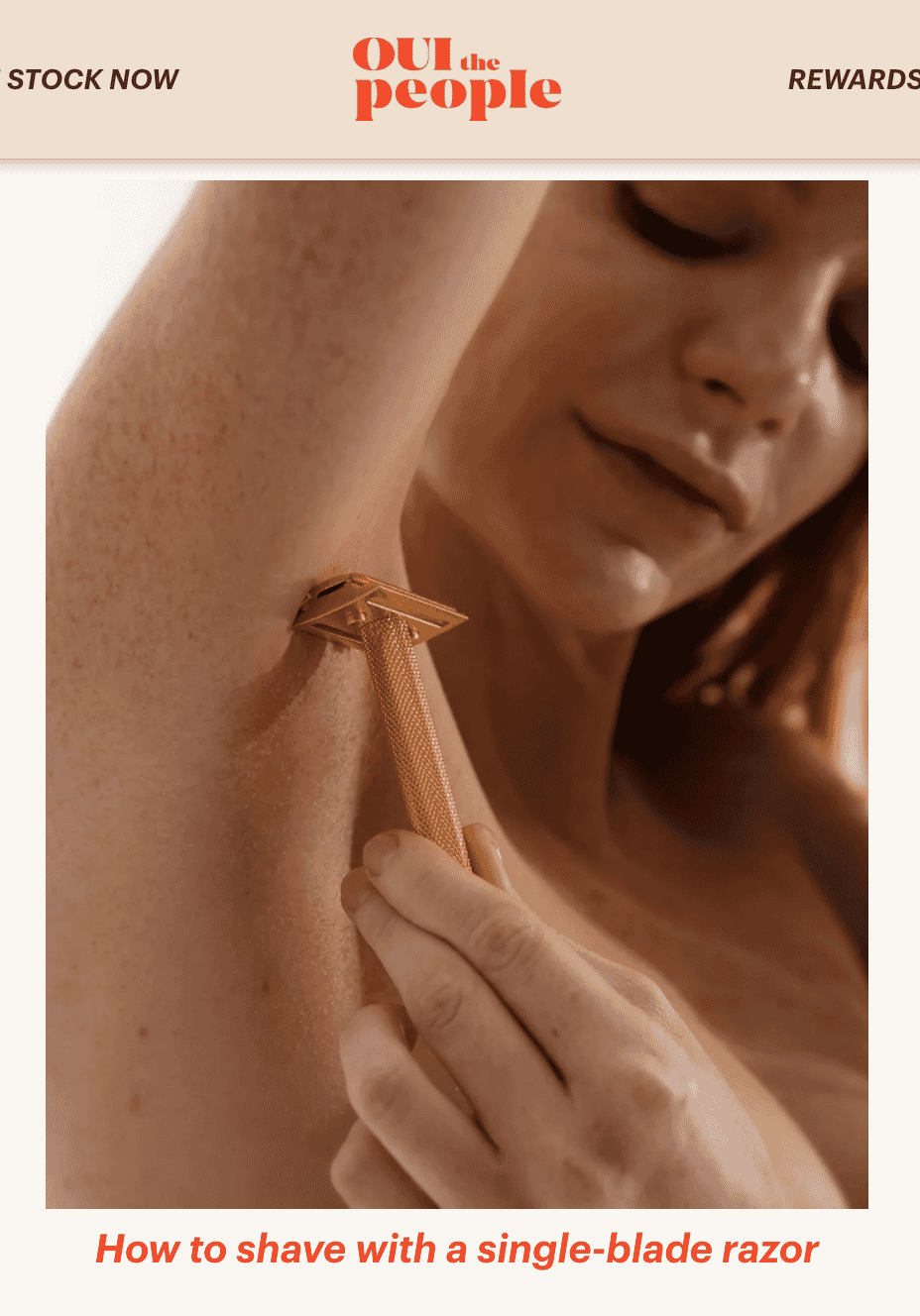 Close-up of a woman using a gold single-blade razor to shave her armpit, by Oui the People
