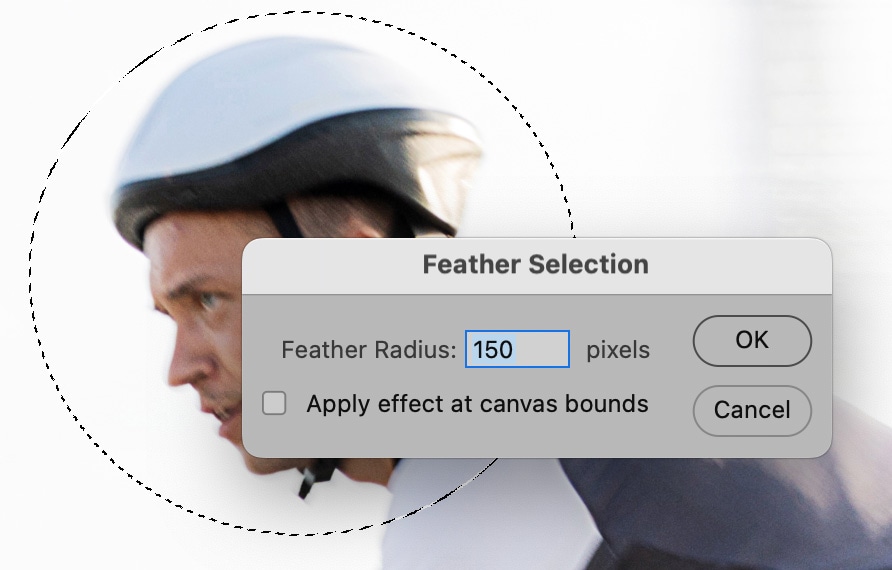 Photoshop feather selection dialog box over a cyclist image, demonstrating how to soften selection edges with a high feather radius.
