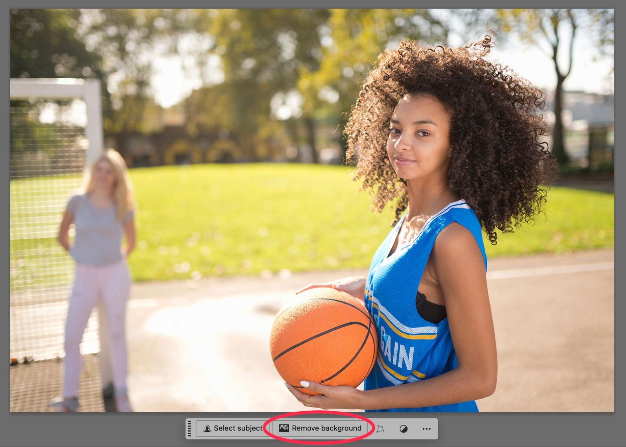 Photoshop 2025 interface showing the Remove Background button active beneath a basketball player image during automated background removal.