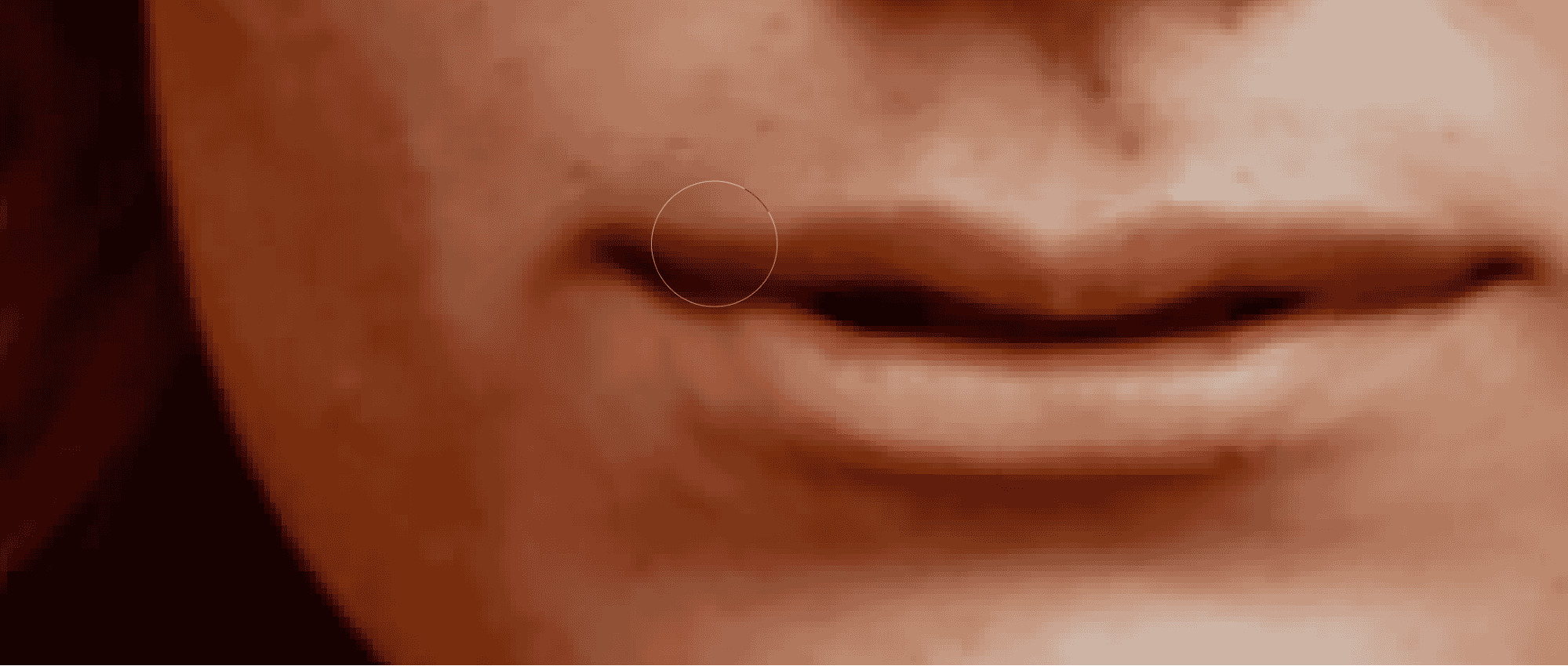 Close-up of smile adjustment in Photoshop using Liquify tool for natural enhancement.